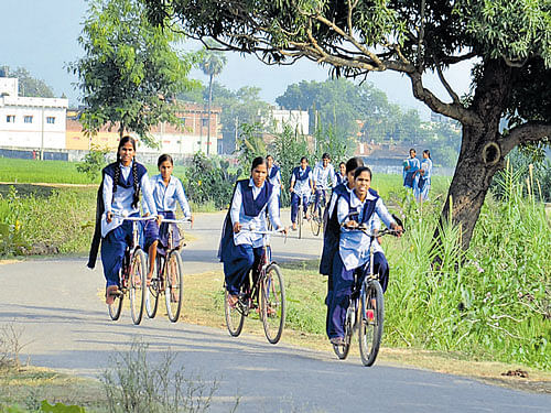 New horizons: Schoolgirls who have benefited from Nitish's school uniform and cycle schemes return home in the interiors of Rajpur, a Maoist belt that shares border with Dumraon (Buxar) and Mohania (Kaimur). PHOTO:&#8200;Mohan Prasad
