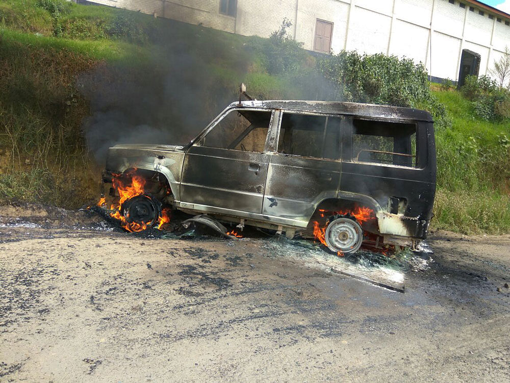 Protesters set ablaze a vehicle to protest against Manipur Chief Minister Okram Ibobi Singh's visit in curfew-bound Ukhrul district of Manipur on Monday. DEEPAK OINAM