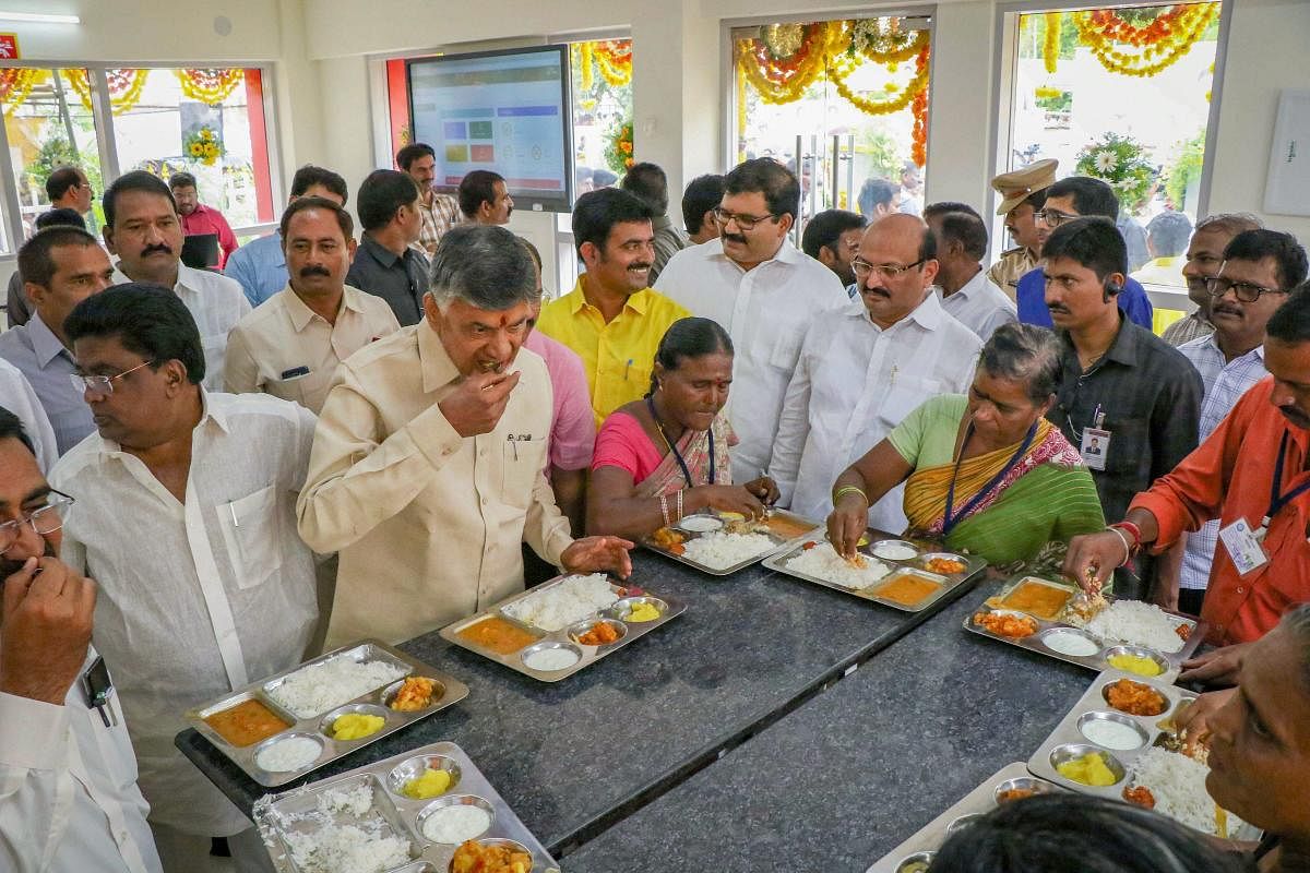 Andhra Pradesh Chief Minister N Chandrababu Naidu has lunch during the launch of Phase I of 'Anna Canteens', that serves meals for Rs. 5, in Vijayawada on Wednesday. PTI Photo