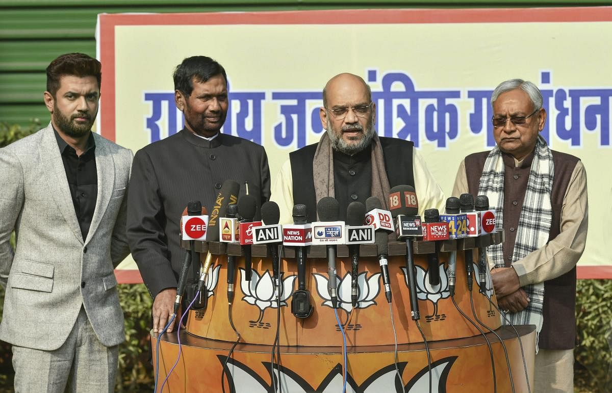 Shah made the announcement in the presence of JD (U) president and Bihar Chief Minister Nitish Kumar and Lok Janshakti Party chief and Union minister Ram Vilas Paswan. (PTI Photo)