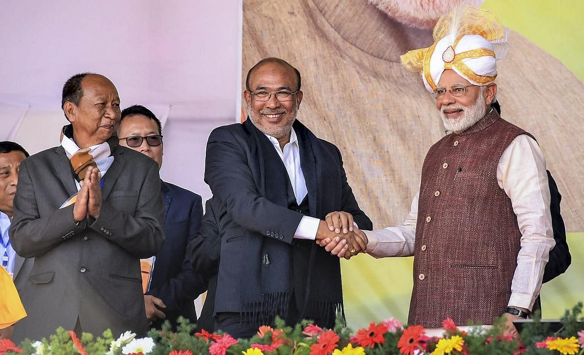Prime Minister Narendra Modi shakes hands with Manipur Chief Minister N Biren Singh during the launch of development projects, in Imphal, Friday, Jan 4, 2019. (PTI Photo)