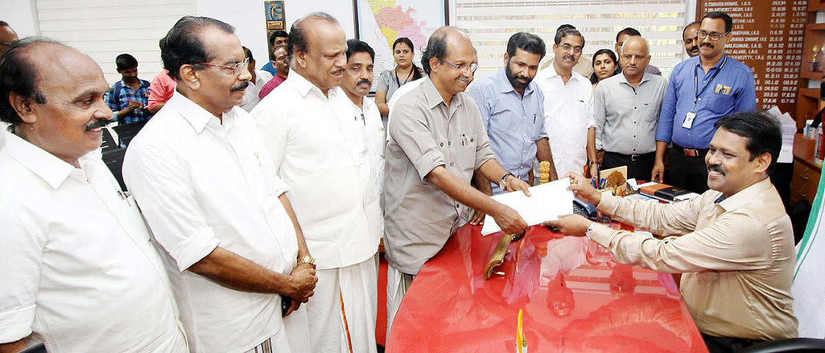 Left Democratic Front (LDF) candidate K P Sathish Chandran submits his nomination papers in Kasargod on Saturday.
