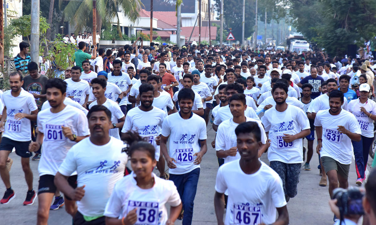 People take part in a marathon organised by Dakshina Kannada Sveep Committee in Mangaluru on Sunday.