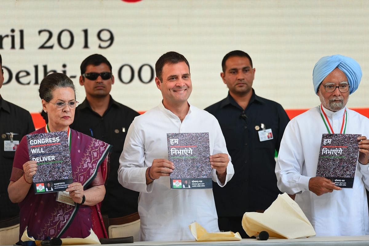 Congress President Rahul Gandhi, senior party leaders Sonia Gandhi and Manmohan Singh release party's manifesto for Lok Sabha polls 2019, in New Delhi on Tuesday. (PTI Photo)