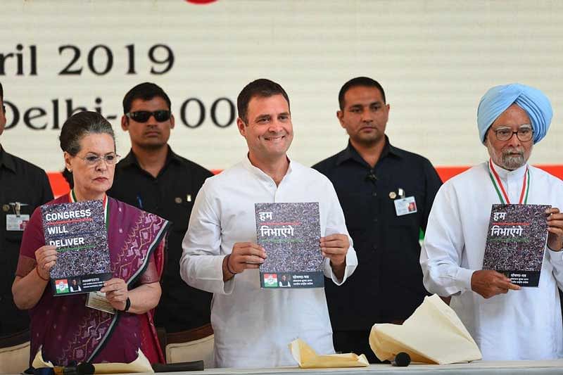 Congress President Rahul Gandhi, senior party leaders Sonia Gandhi and Manmohan Singh release the party's manifesto for Lok Sabha polls 2019, in New Delhi. (PTI Photo)