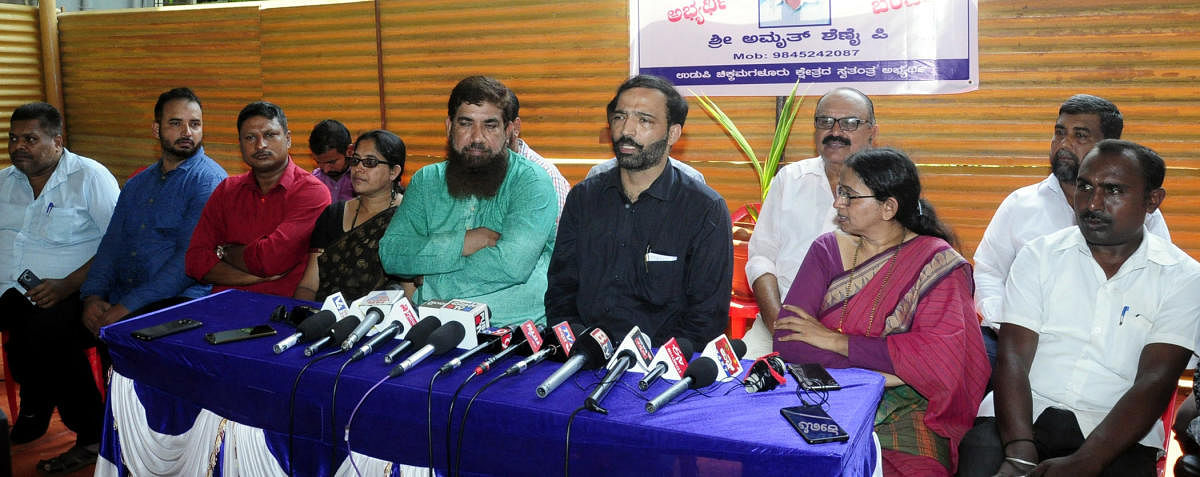 Independent candidate Amrith Shenoy speaks to reporters in Udupi on Tuesday.