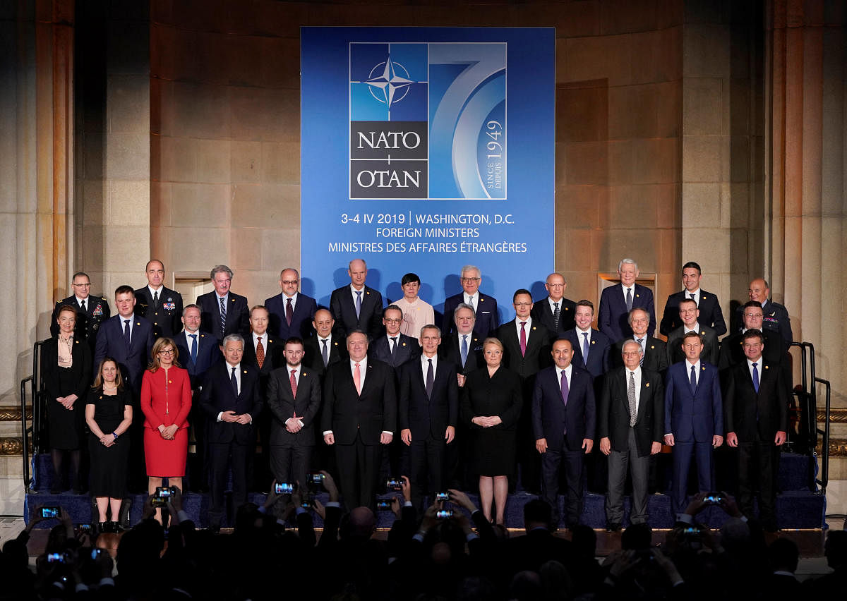 NATO foreign ministers pose for a family photo a reception to celebrate NATO's 70th anniversary in Washington. (Reuters Photo)s