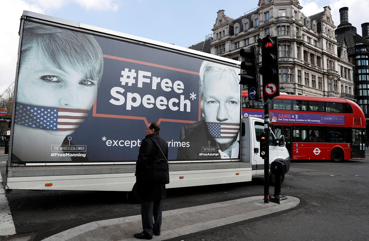 A truck carrying a poster relating to WikiLeaks founder Julian Assange, who has been living at Ecuador's embassy in London, drives through London, Britain April 3, 2019. REUTERS