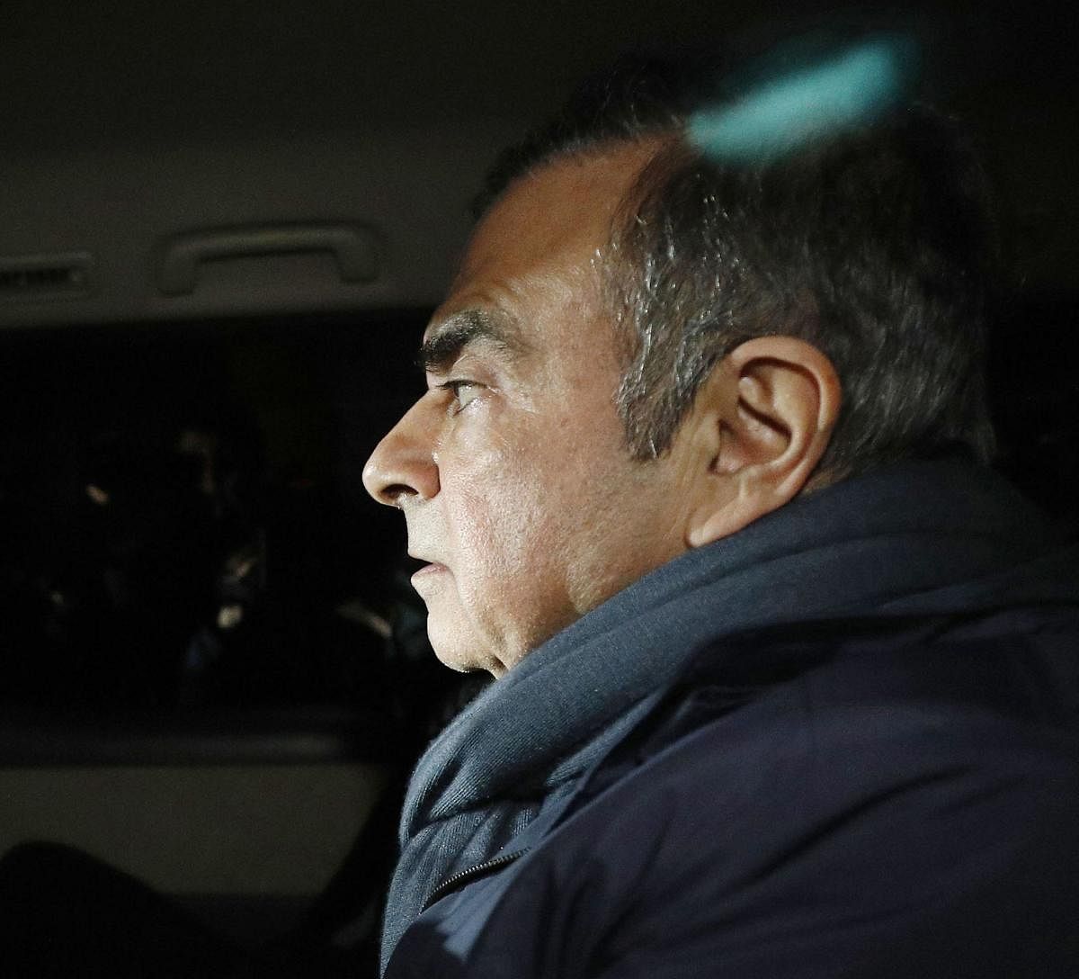 In this April 3, 2019 photo, former Nissan Chairman Carlos Ghosn in a car leaves his lawyer's office in Tokyo. Japanese prosecutors took Ghosn for questioning Thursday, April 4, 2019, barely a month after he was released on bail ahead of his trial on fina