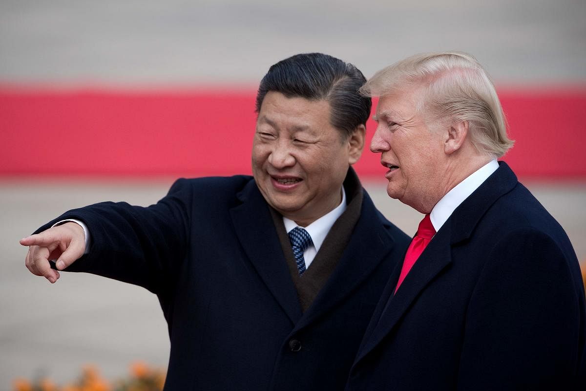 In this file photo taken on November 8, 2017, China's President Xi Jinping (L) and US President Donald Trump attend a welcome ceremony at the Great Hall of the People in Beijing. - The White House on April 4, 2019, stoked anticipation Trump could announce