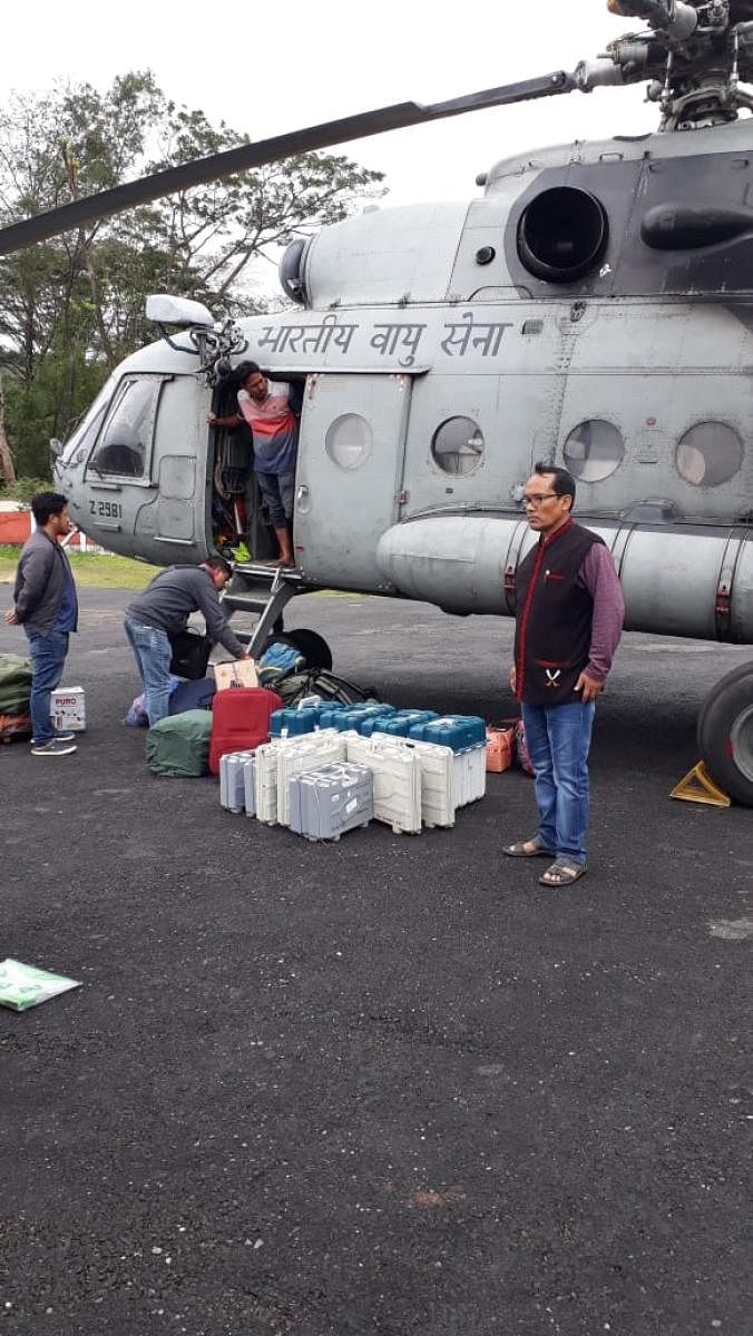 Polling personnel after being airlifted at Vijaynagar, Arunachal Pradesh on Thursday. Photo credit: CEO, Arunachal Pradesh.