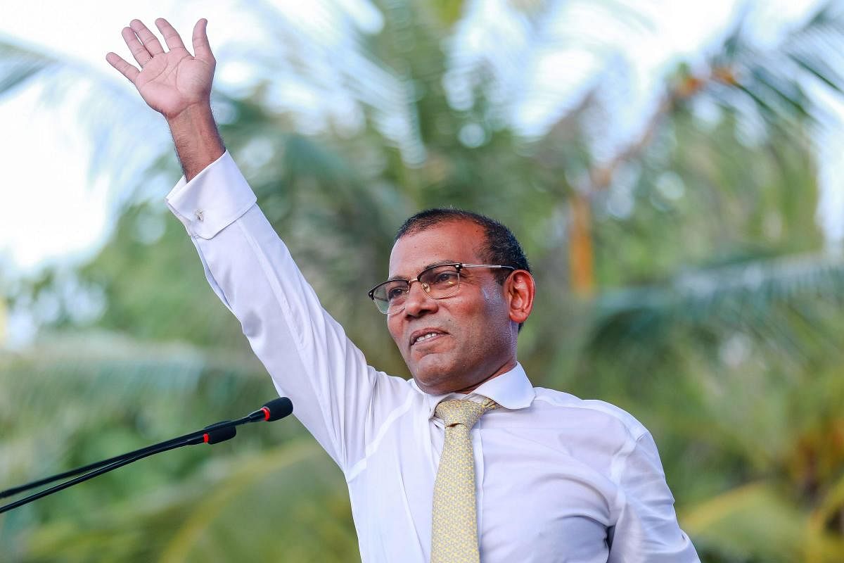 In this file photo taken on November 1, 2018 former president of the Maldives Mohamed Nasheed waves as he addresses the country after returning from exile to the Maldives. AFP file photo.