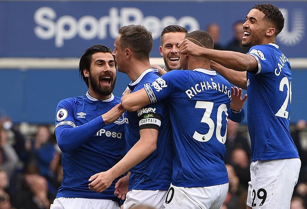 BIG GOAL: Everton defender Phil Jagielka (second left) celebrates with team-mates after scoring against Arsenal on Sunday. AFP
