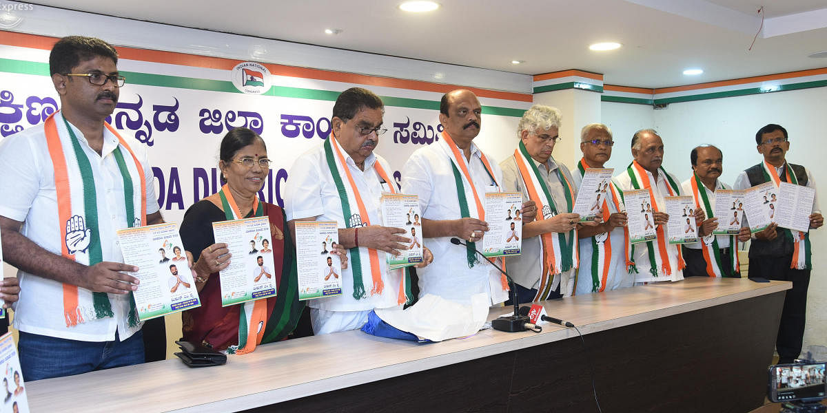 MLC and DCC president Harish Kumar releases the Congress manifesto for Dakshina Kannada at the party office in Mangaluru on Sunday.