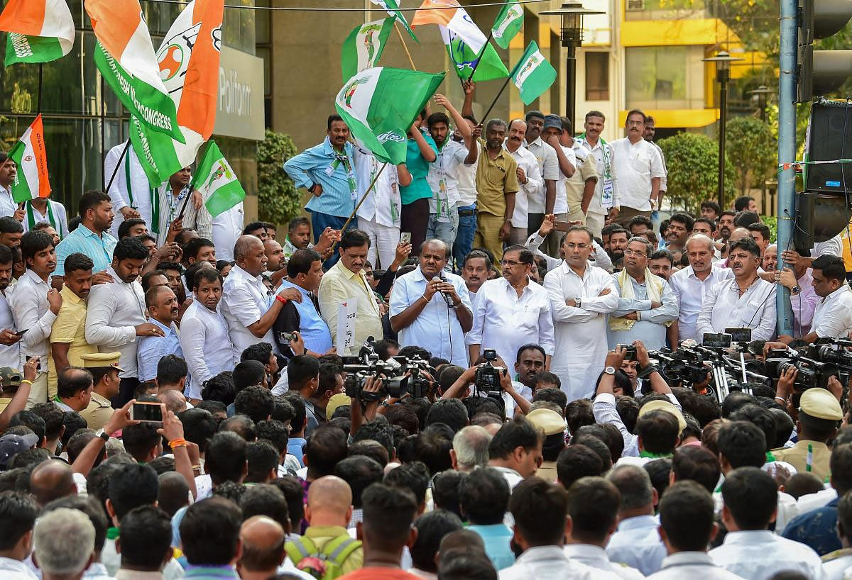  Karnataka Chief Minister HD Kumaraswamy, his deputy G Parameshwara, KPCC President Dinesh Gundu Rao and state minister DK Shivakumar during a protest against the Income Tax department for the raids on JD(S) leaders, in Bengaluru, Thursday, March 28, 2019. (PTI Photo)