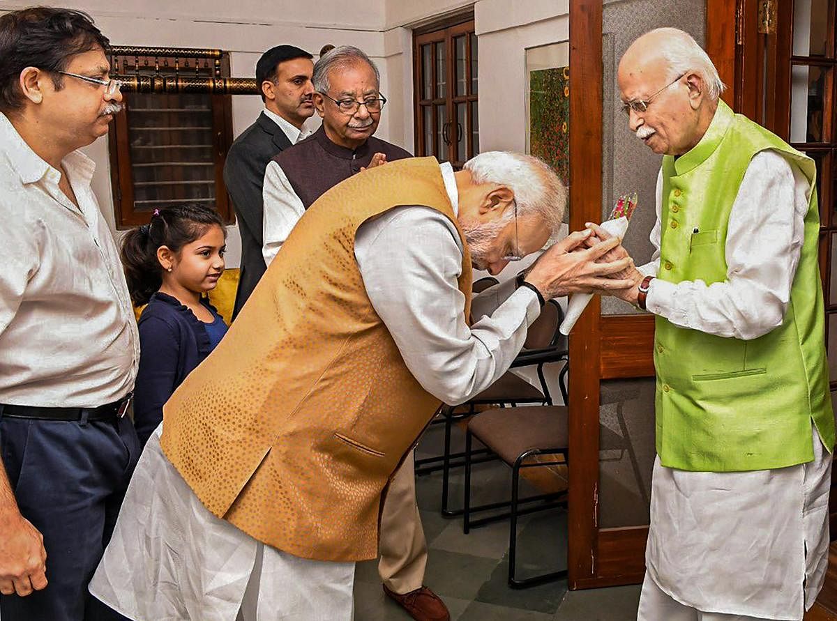 Prime Minister Narendra Modi greets BJP senior leader L K Advani on his birthday at his residence, in New Delhi, on November 8, 2018. Twitter Photo via PTI