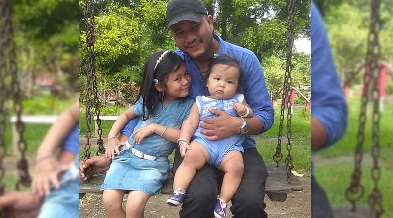The detained journalist Kishorechandra Wangkhem with his two daughters. DH photo