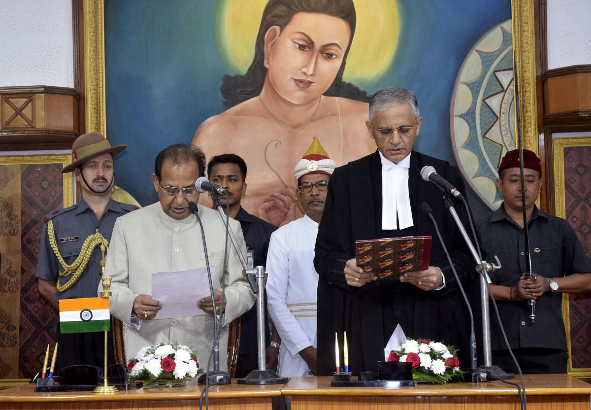 Assam governor Jagdish Mukhi administering the oath of office to Justice Ajjikuttira Somaiah Bopanna, as new chief justice of Gauhati High court, at Raj Bhavan, Guwahati on Monday morning. (Photo by Manash Das)