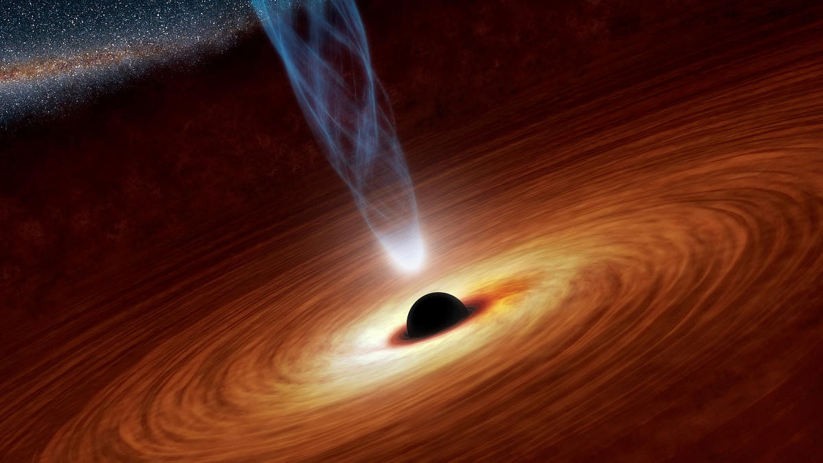 A supermassive black hole with millions to billions times the mass of our sun is seen in an undated NASA artist's concept illustration