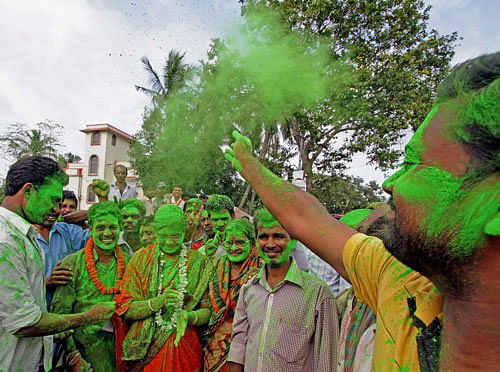 Supporters celebrate the victory of Trinamool Congress supported independent candidate Prasanta Mukherjee in panchayat elections at Bolpur in Birbhum district of West Bengal on Monday. PTI Photo
