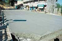 The concretisation work in progress on Madikeri Private Bus Stand - Mangerira Muthanna Circle stretch in Madikeri. dh photo