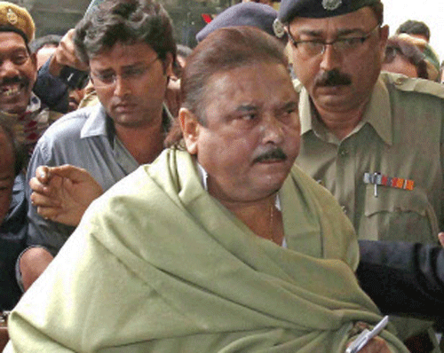 West Bengal Transport Minister Madan Mitra, who was arrested by CBI in the multi-crore Saradha scam, was today brought to Alipore Court for production amid statewide protest by the supporters and workers of ruling Trinamool Congress. PTI photo