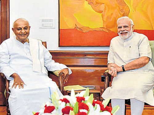 JD(S) supremo H D Deve Gowda with Prime Minister Narendra Modi in New Delhi on Friday.