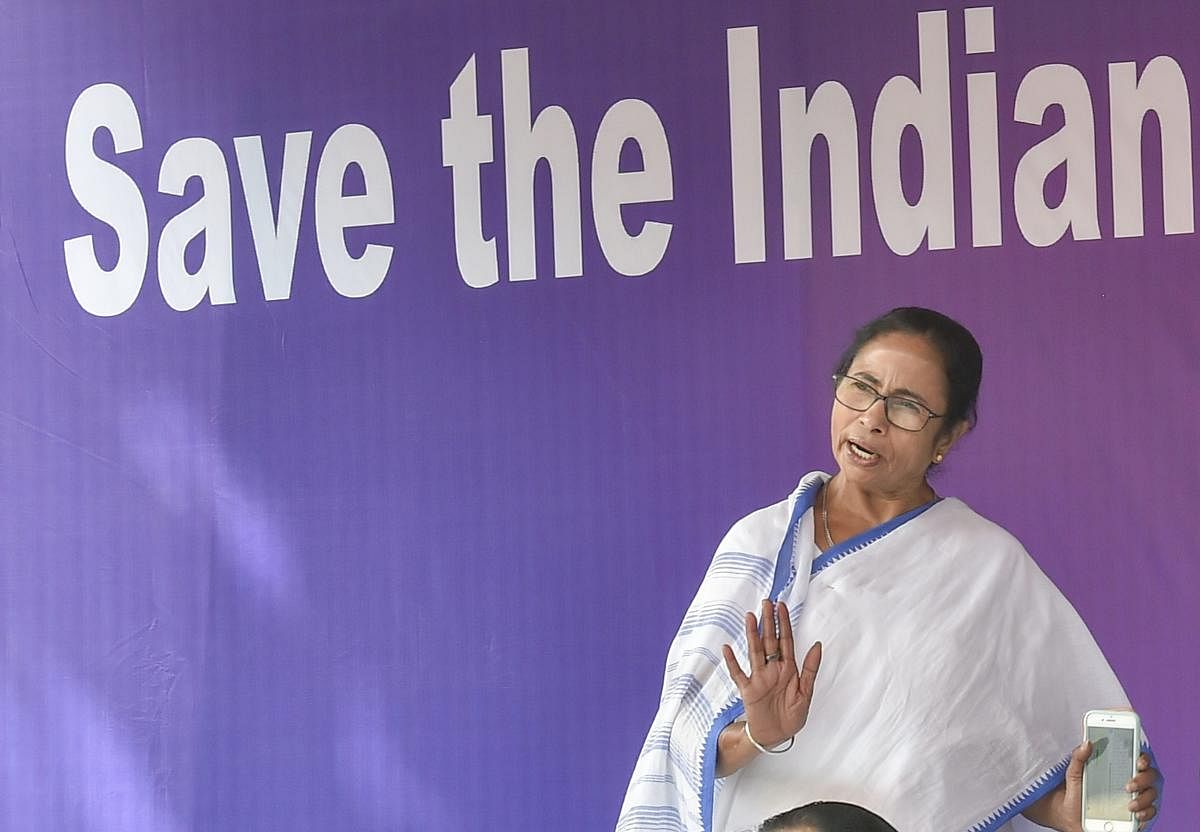 West Bengal Chief Minister Mamata Banerjee speaks to her party workers during a sit-in over the CBI's attempt to question the Kolkata Police commissioner in connection with chit fund scams, in Kolkata, Monday, Feb. 04, 2019. (PTI Photo)