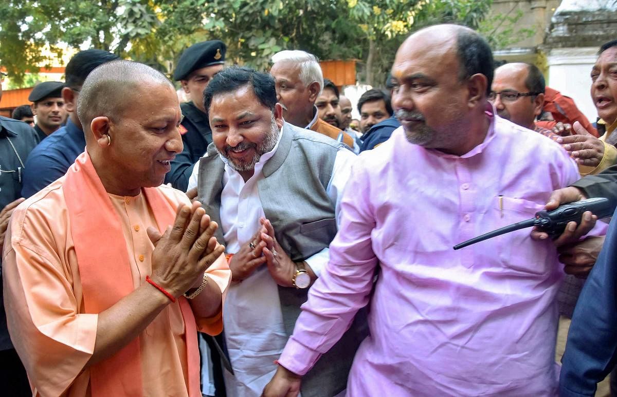 Uttar Pradesh Chief Minister Yogi Adityanath is greeted as he arrives at Bharatiya Janata Party (BJP) office, in Lucknow, Monday, March 11, 2019. (PTI Photo)