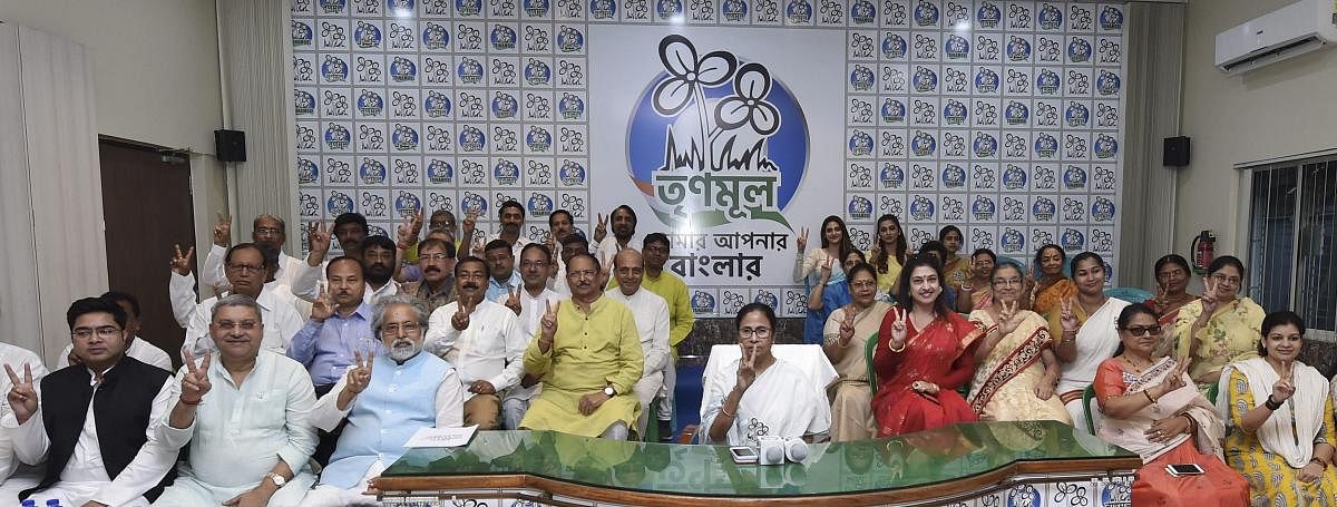 West Bengal Chief Minister and TMC Supremo Mamata Banerjee poses with her party candidates, contesting for the upcoming Lok Sabha polls, during a meeting, in Kolkata, Wednesday, March 13, 2019. (PTI Photo)