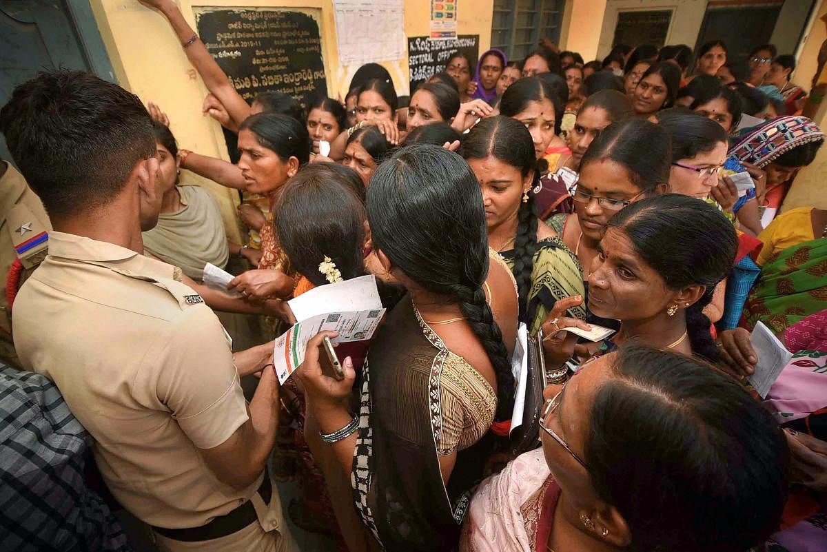 Women wait to cast their votes for Lok Sabha and Assembly elections at a polling station in Rangareddy district, Thursday, April 11, 2019. (PTI Photo)