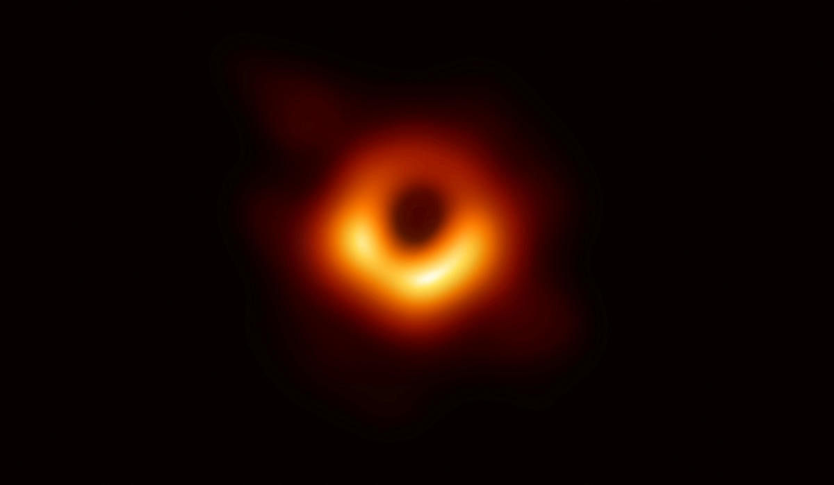 The first ever photo of a black hole, taken using a global network of telescopes, conducted by the Event Horizon Telescope (EHT) project, to gain insight into celestial objects with gravitational fields so strong that no matter or light can escape, is sho