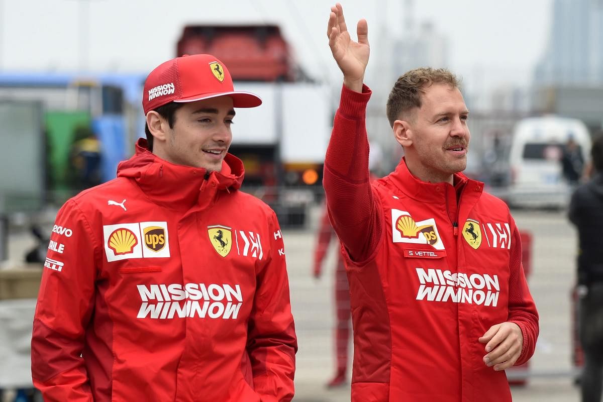 Ferrari's Sebastian Vettel (right) and Charles Leclerc . AFP