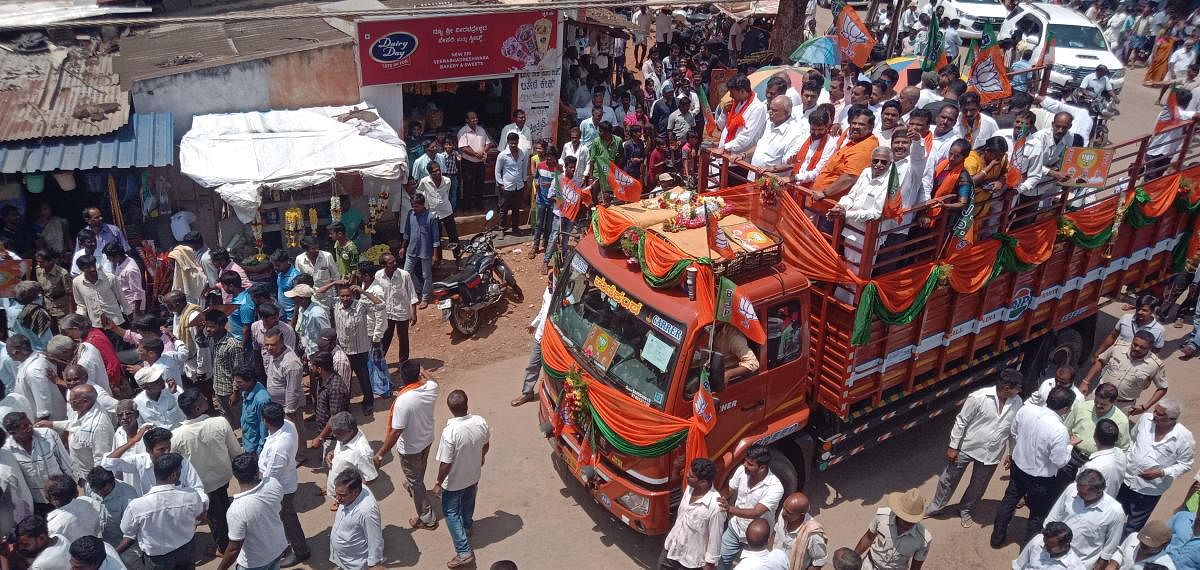 BJP state president B S Yeddyurappa participates in a road show in Kadur on Thursday.