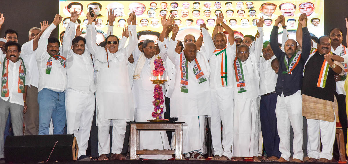 JD(S)-Congress leaders show unity, during an election campaign, at Maharaja's College grounds in Mysuru on Friday. dh photo