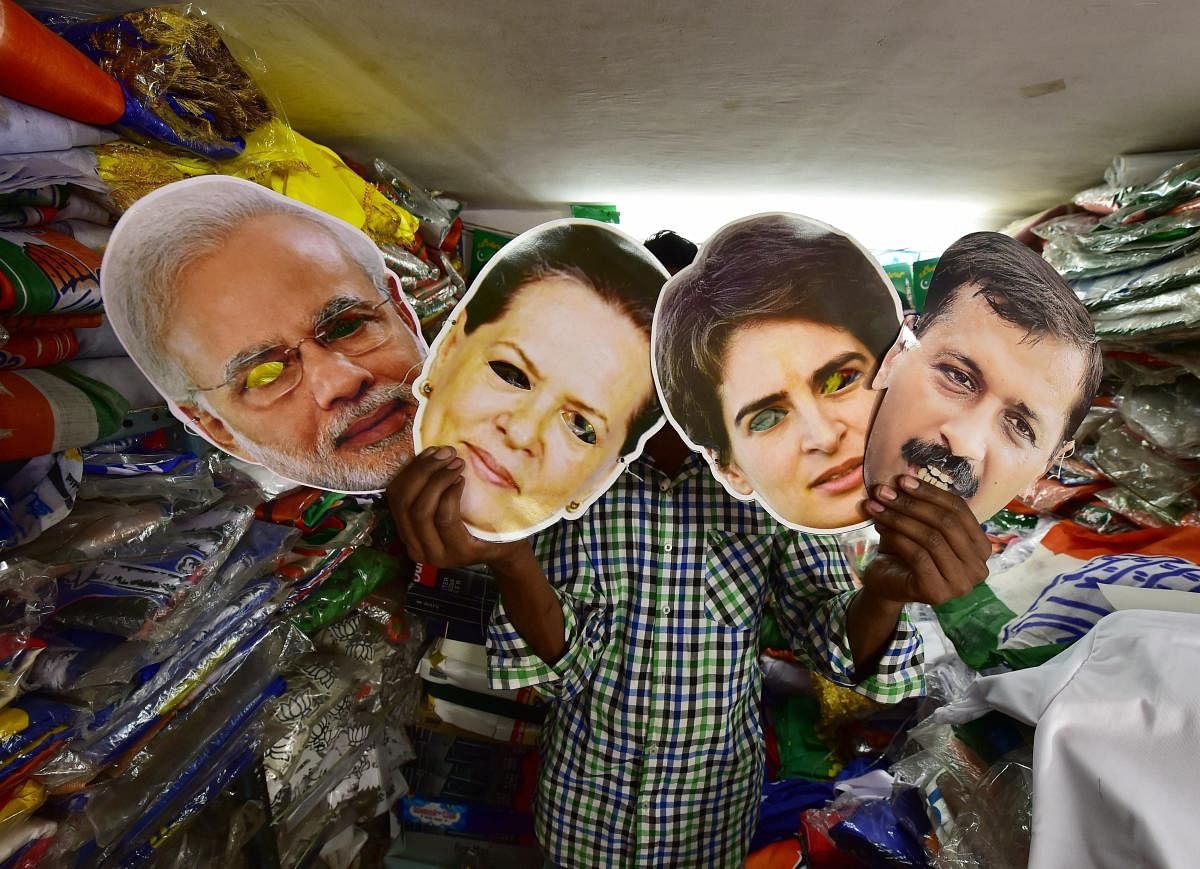 New Delhi: A salesman displays masks of Prime Minister Narendra Modi, Congress leaders Sonia Gandhi, Priyanka Gandhi Vadra and AAP leader Arvind Kejriwal at a shop, ahead of the Lok Sabha polls, in New Delhi, Wednesday, April 3, 2019. (PTI Photo/ Manvender Vashist) 
