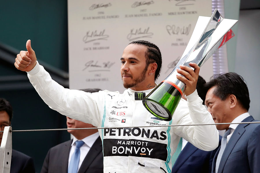 Lewis Hamilton with the trophy after winning the Chinese Grand Prix. Picture credit: Reuters