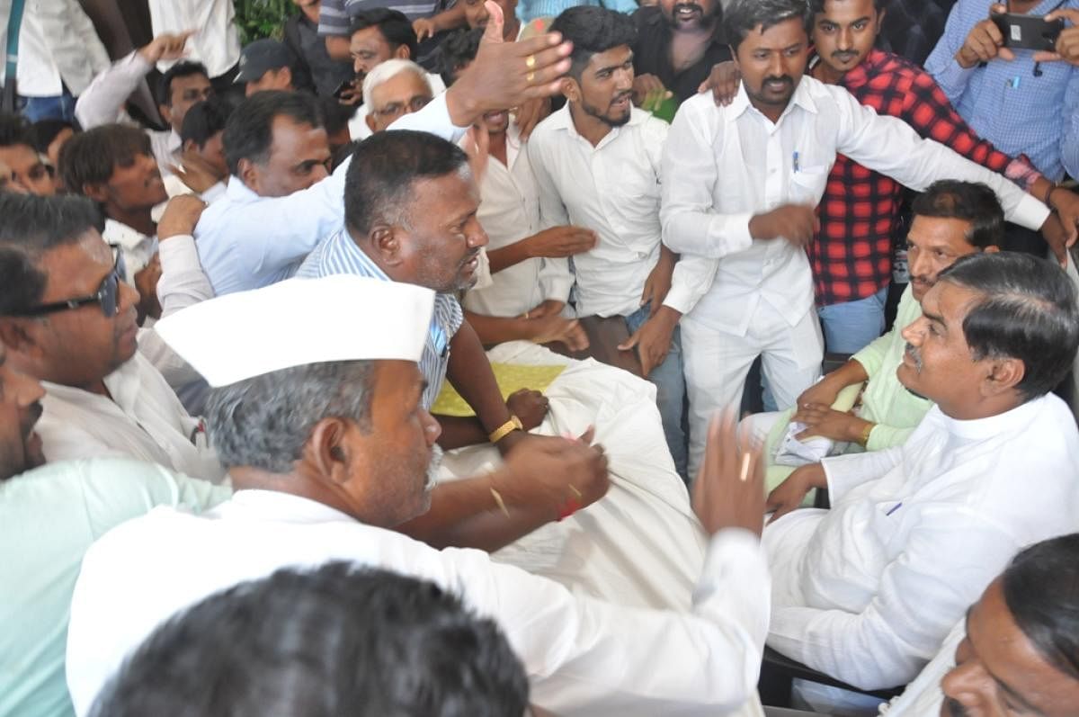 The commotion at the press meet of Muddebihal MLA A S Patil Nadahalli, in Vijayapura on Saturday. DH Photo