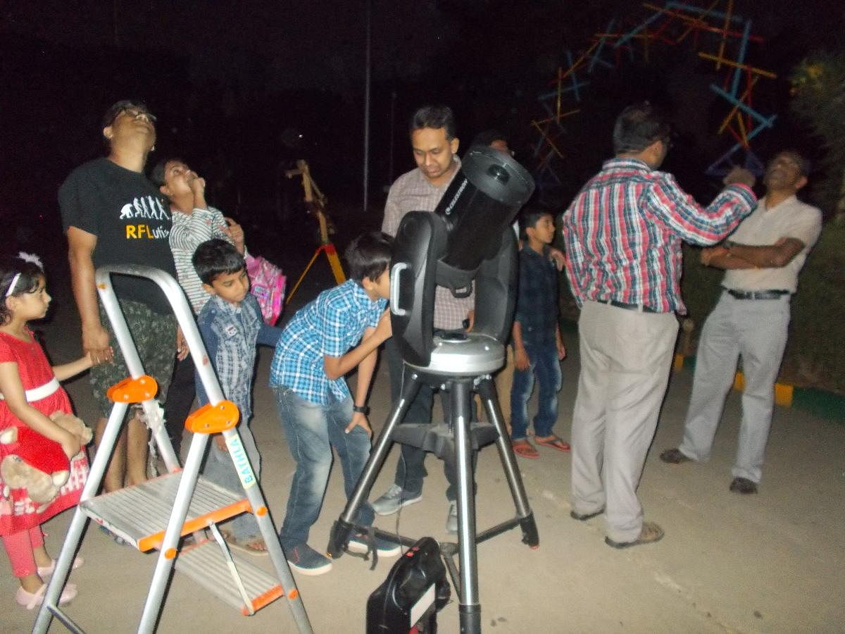 Children and parents at the Sky Watch programme at the Jawaharlal Nehru Planetarium early on Saturday morning.