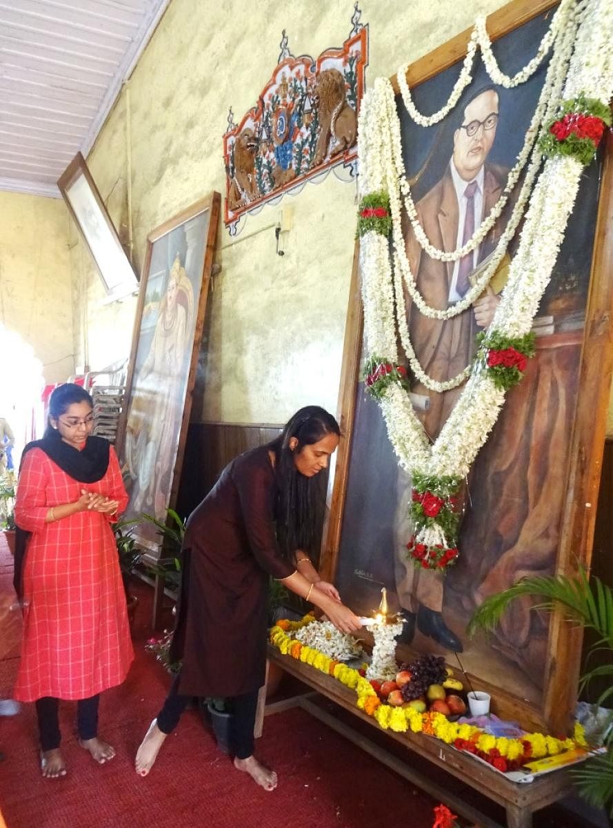 Deputy Commissioner Annies Kanmani Joy offers floral tributes to the portrait of Dr B R Ambedkar during the 128th Ambedkar Jayanti observed by the district administration, Zilla Panchayat and Social Welfare Department at the Old Fort Hall in Madikeri on S