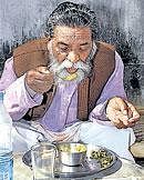 JMM chief Shibu Soren enjoys his lunch at his residence in Ranchi on Sunday. PTI