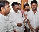 Former Jharkhand Chief Minister and BJP General Secretary Arjun Munda (centre), All Jharkhand Student's Union (AJSU) chief Sudesh Mahato (left) and Jharkhand Mukti Morcha leader Hemant Soren (second from right) at the BJP headquarters in Ranchi on Tuesday.  PTI