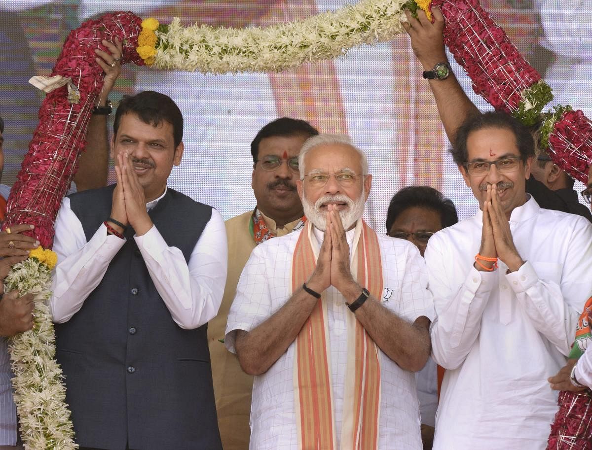 Prime Minister Narendra Modi, Shiv Sena chief Uddhav Thackeray and Maharashtra CM Devendra Fadanvis (L) at an election campaign rally in support of alliance candidates at Ausa in Latur district, Maharashtra, Tuesday, April 9, 2019. (PTI Photo)