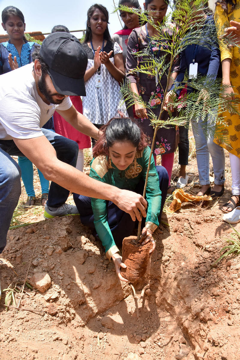 Diganth and Aindrita planting saplings at Soundarya Institute of Management and Science at Sidedahalli on her birthday on April 16.