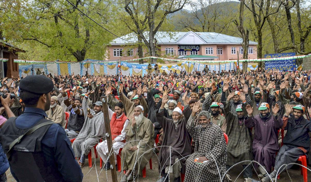 Congress supporters raise pro-party slogans during an election rally attended by Ghulam Nabi Azad and Anantnag parlimentary candidate Ghulam Ahmad Mir, in Anantnag district of south Kashmir, Tuesday, April 16, 2019. (PTI Photo)