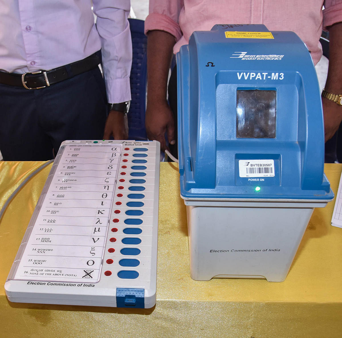 This is what your electronic voting machine looks like. It works with a paper audit system (right). photo by S K Dinesh