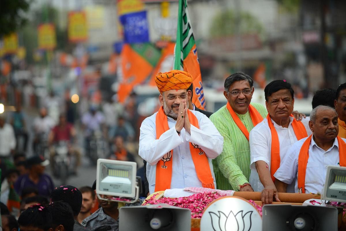 Bhartiya Janta Party (BJP) President thanks his supporters during a road show at Kalol town, some 30 km from Ahmedabad. - India's gargantuan election, the biggest in history, kicked off on April 11 with Prime Minister Narendra Modi seeking a second term f