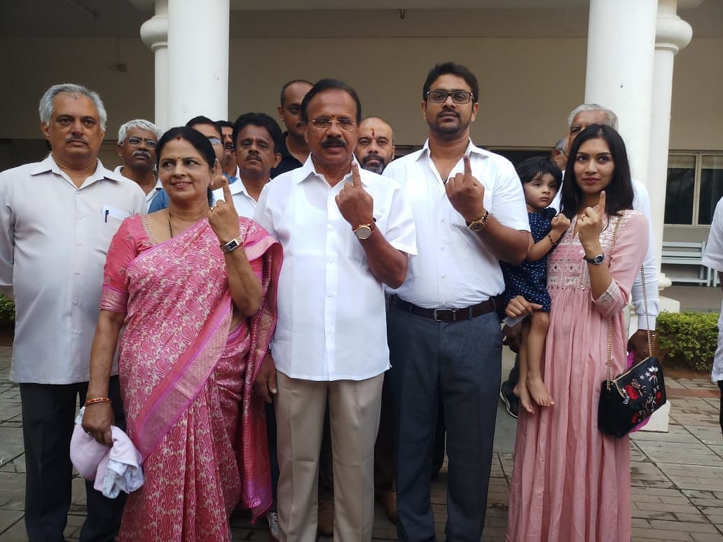 Union minister Sadananda Gowda with his family pose for photo  after casting votes in Bengaluru on Thursday. (DH Photo) 