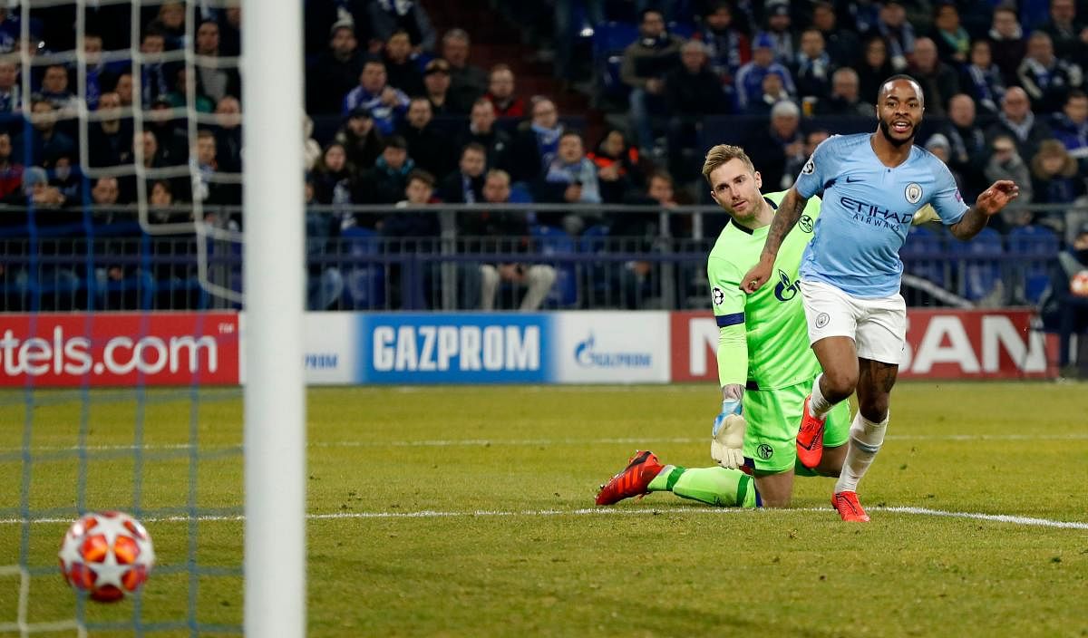 Manchester City's Raheem Sterling (right) is extremely delighted while Schalke's Ralf Faehrmann is shocked as the ball heads into the net during their Champions League game on Wednesday night. AFP 
