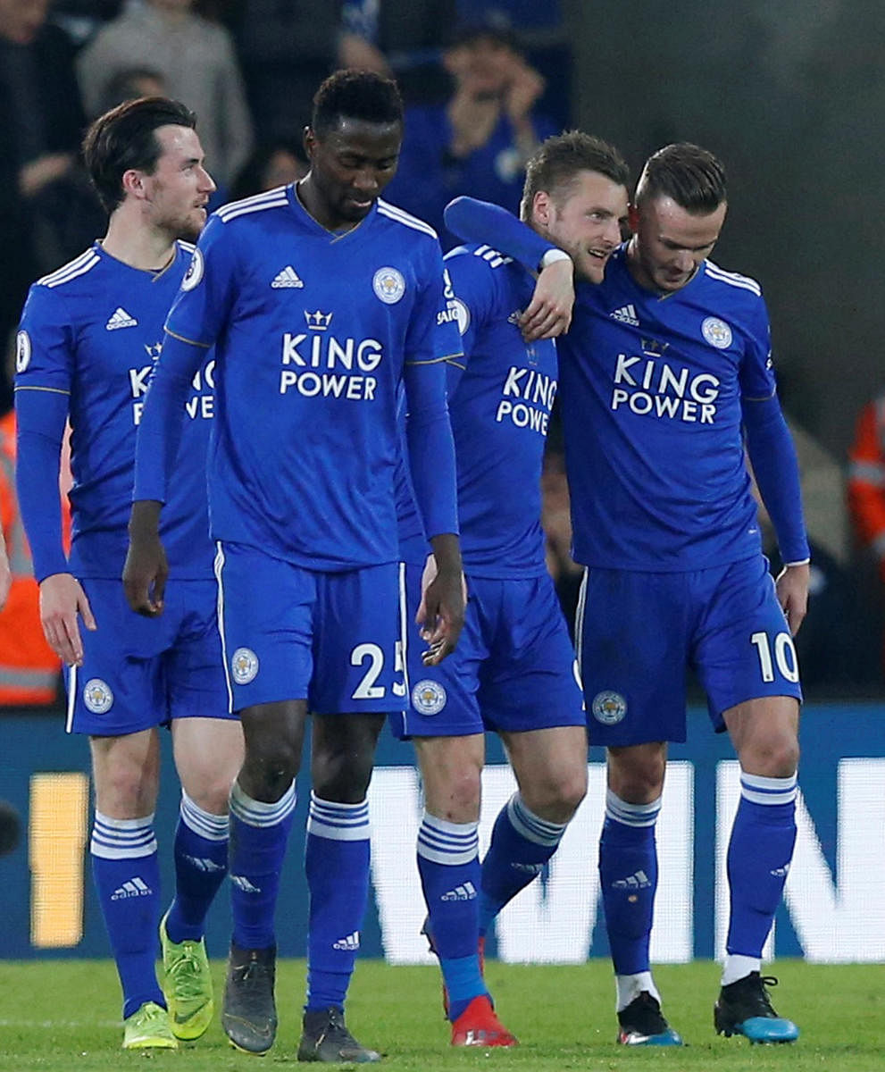 Leicester City's Jamie Vardy (second from right) celebrates with team-mates after scoring against Brighton on Tuesday night. REUTERS